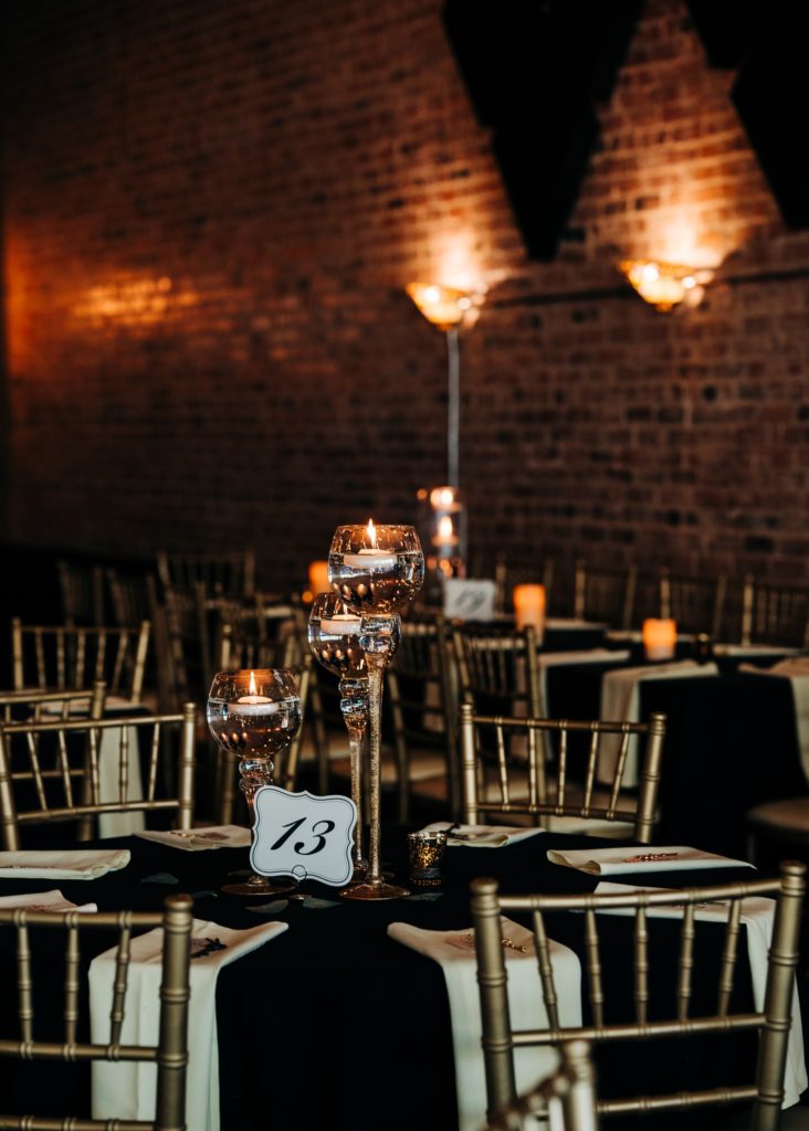 Black linens and Gold Chiavari Chairs accenting a round table at The 1206 in Crete NE